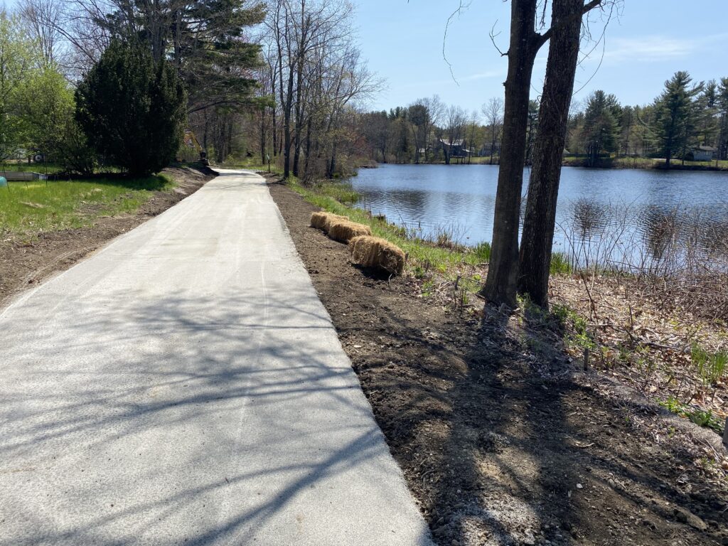 The Squannacook River Rail Trail approaching Old Harbor Village